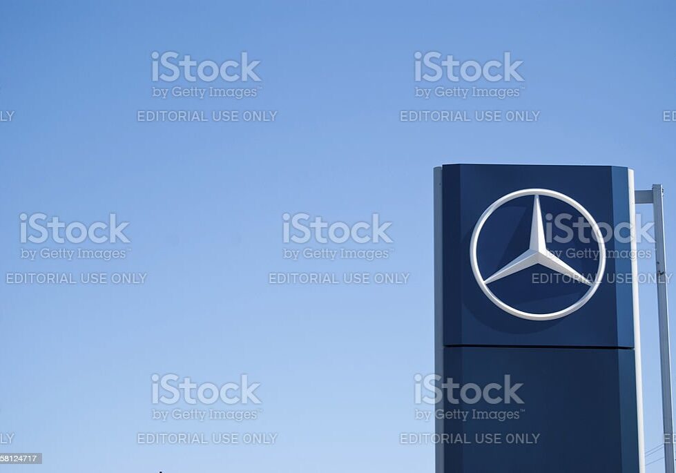 "Halifax, Nova Scotia Canada - March 27, 2011: A photograph of a large Mercedes-Benz dealership sign at a car dealership in Halifax, Nova Scotia, Canada.  The business sign contains the large iconic Mercedes-Benz 3 point star logo"